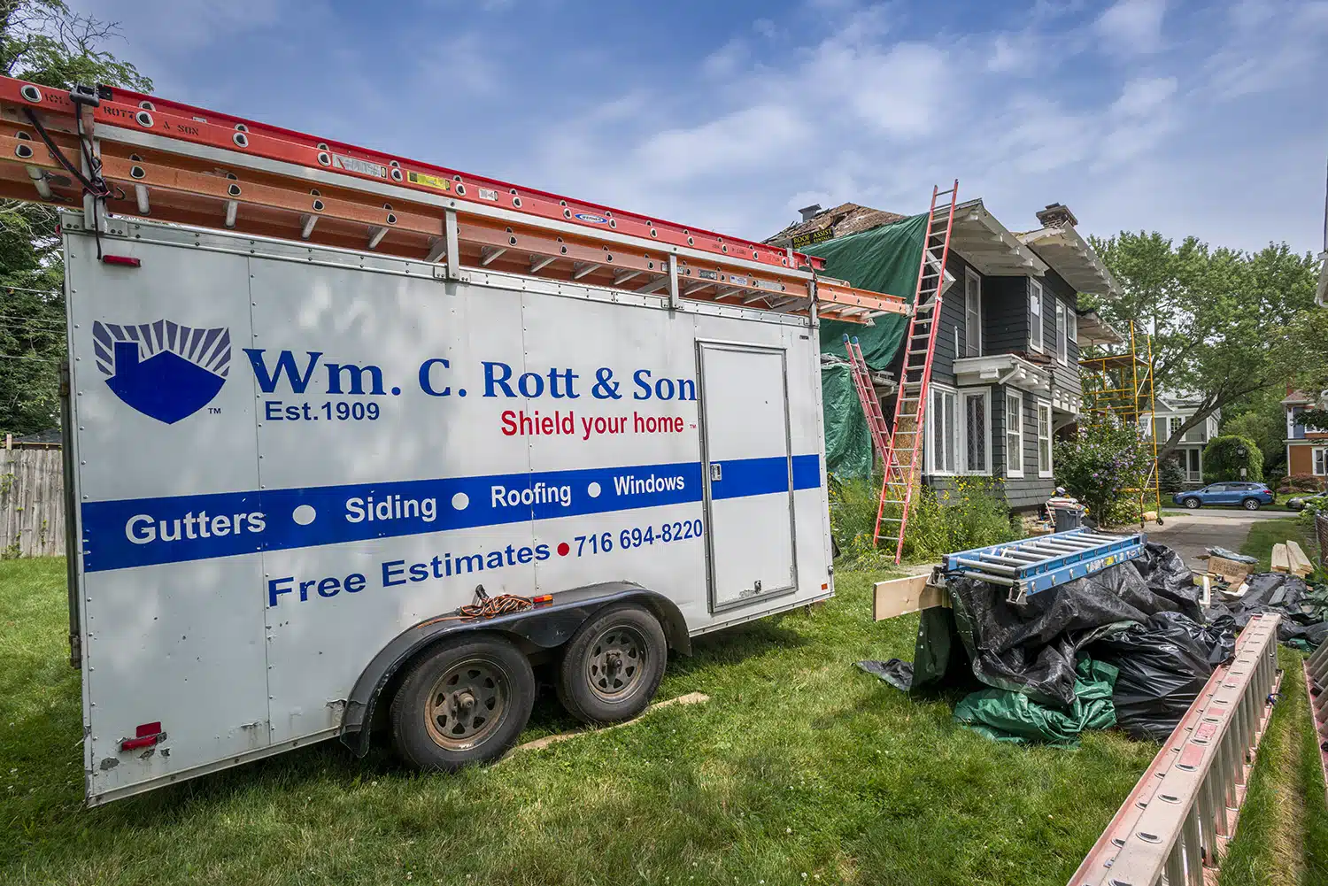 W..c.Rott and Son trailer outside of residential home roof replacement in Buffalo.